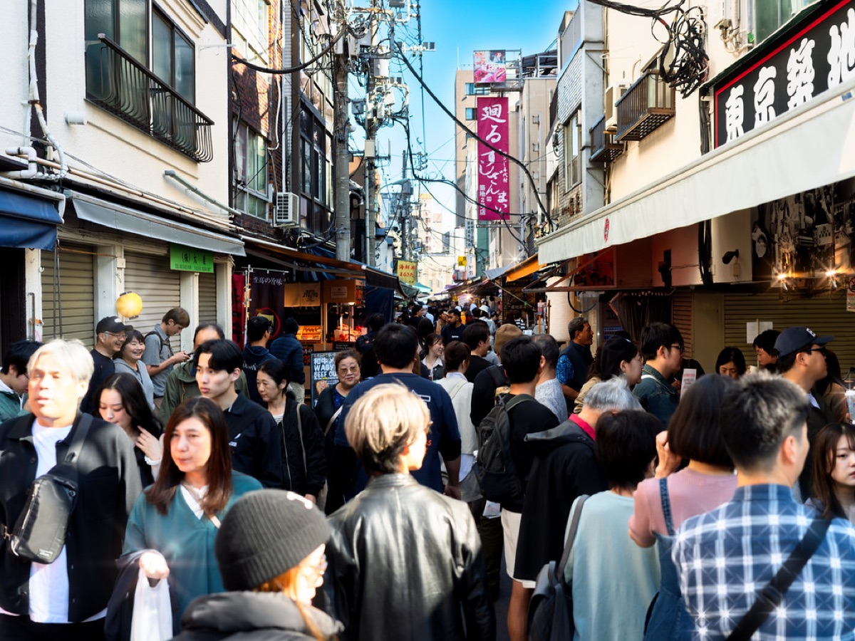 Local Tokyo street food vendor selling skewered octopus and tempura