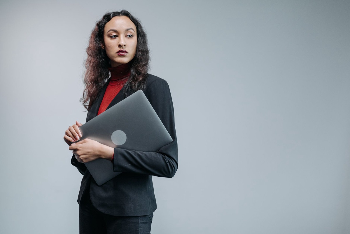 Office worker in pantsuit showing professional attire