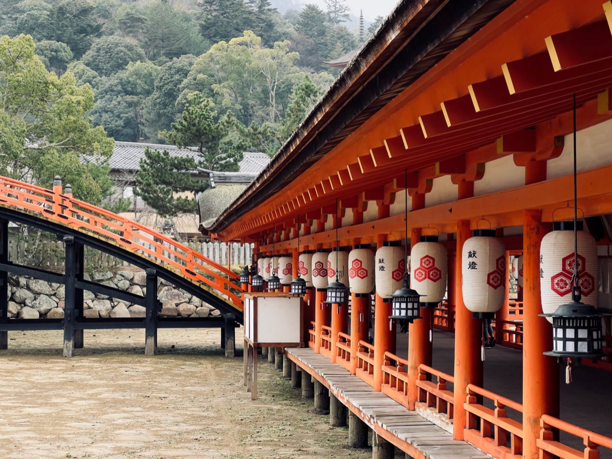 traditional shrine and red-tiled house in Japanese countryside