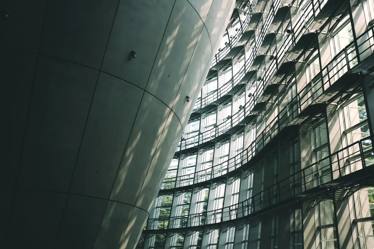 Explore the sleek, modern design of a Tokyo museum with glass and concrete elements.